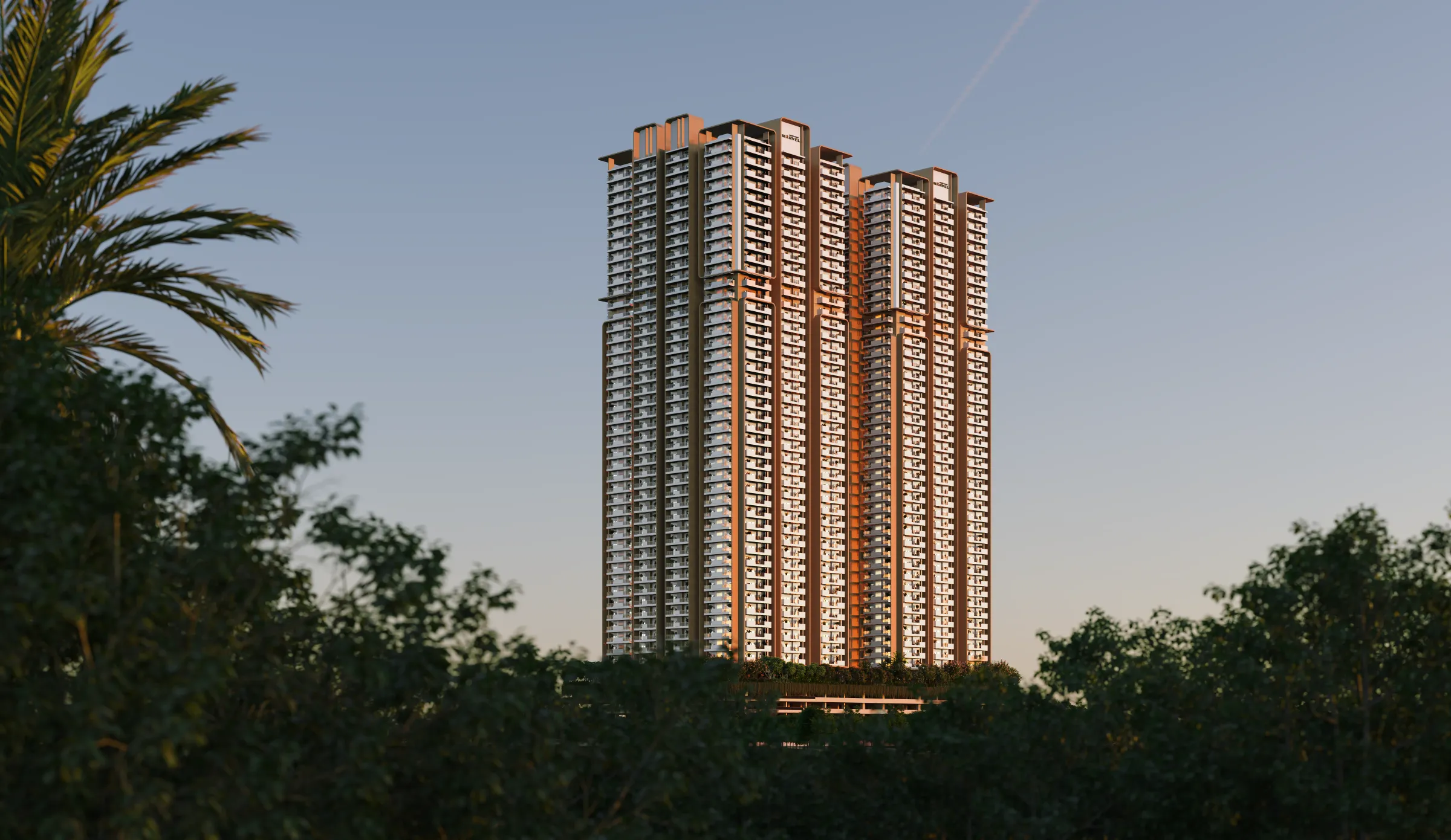 Marvel's towers lit at golden hour above the trees